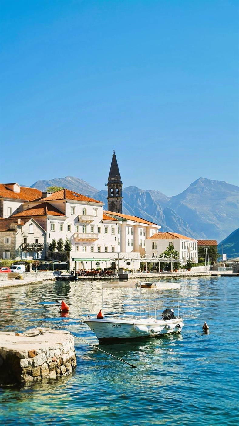 Perast waterfront with its church tower, seen from the water